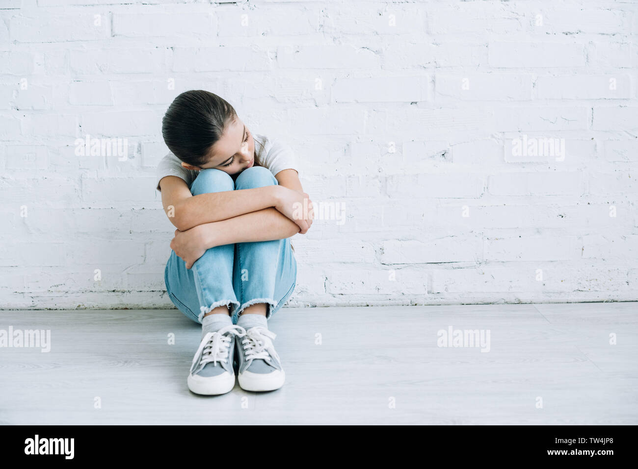 Sad girl preteen sitting on hi-res stock photography and images - Alamy