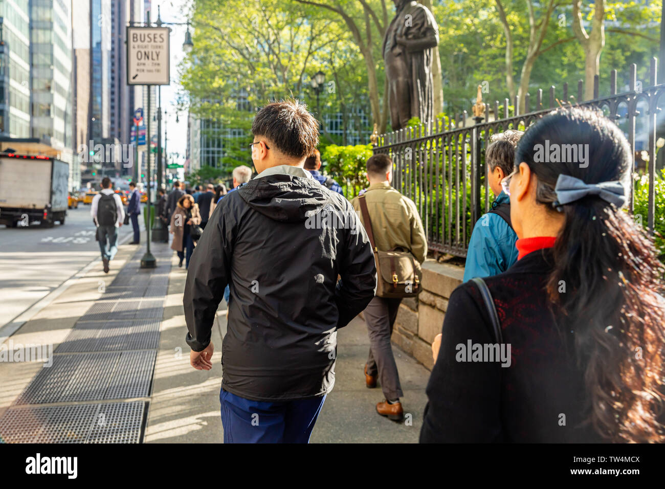 USA, New York, Manhattan downtown. May 6, 2019. Crowded streets, busy people walking in a spring sunny morning Stock Photo