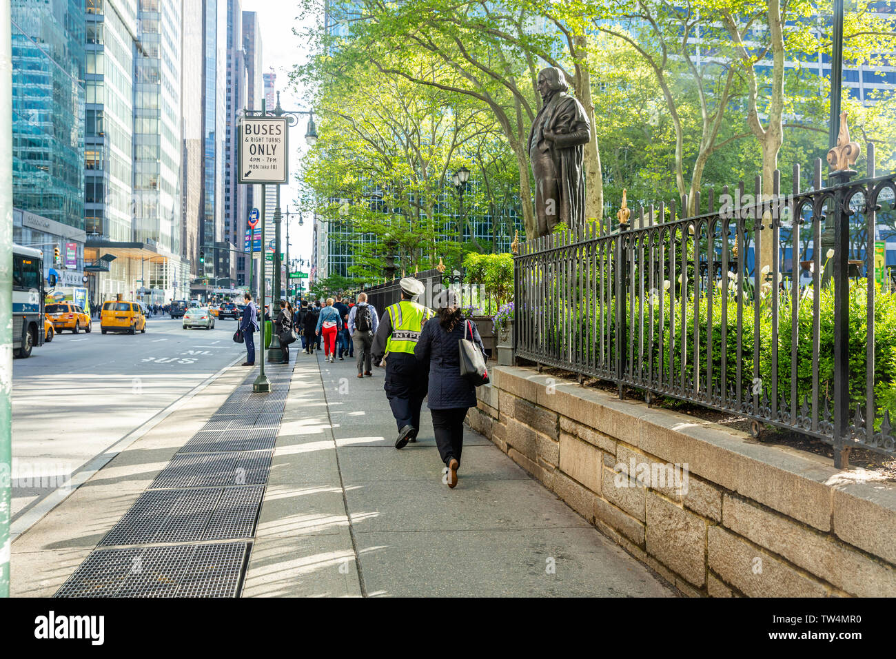 USA, New York, Manhattan downtown. May 6, 2019. Crowded streets, busy people walking in a spring sunny morning Stock Photo