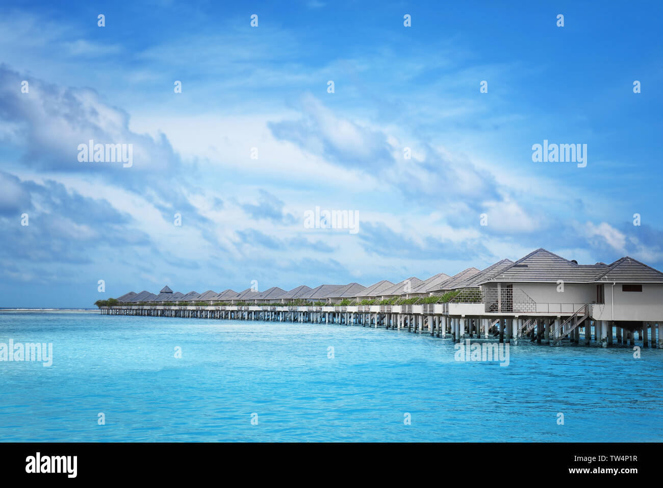 Modern beach houses on piles at tropical resort Stock Photo Alamy