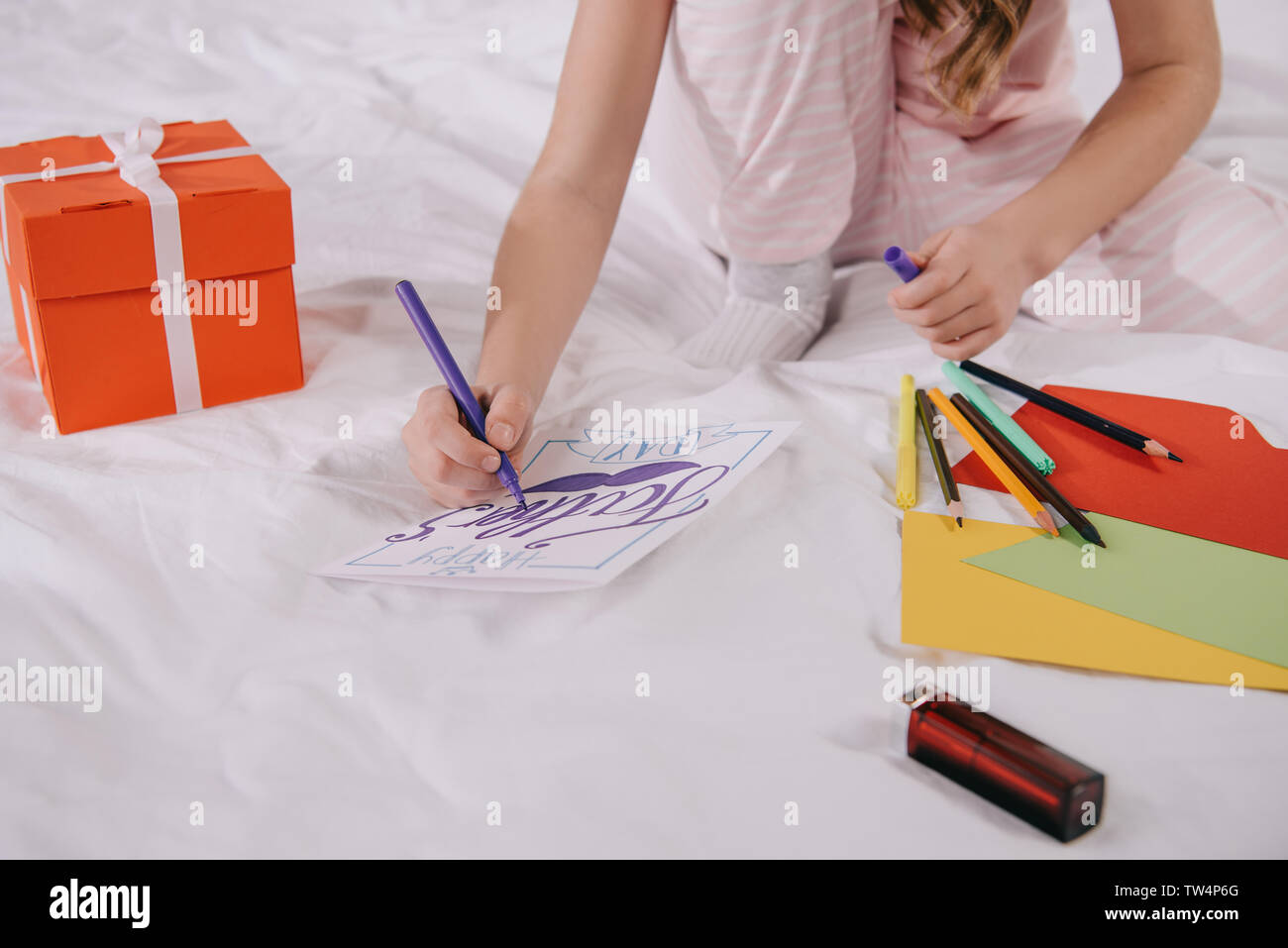 cropped view of child drawing fathers day greeting card near gift box ...