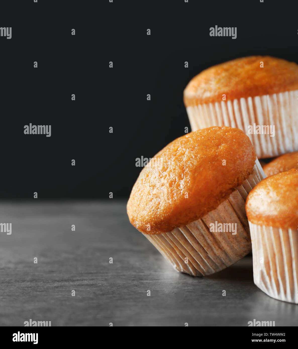 Delicious carrot muffins on dark background Stock Photo