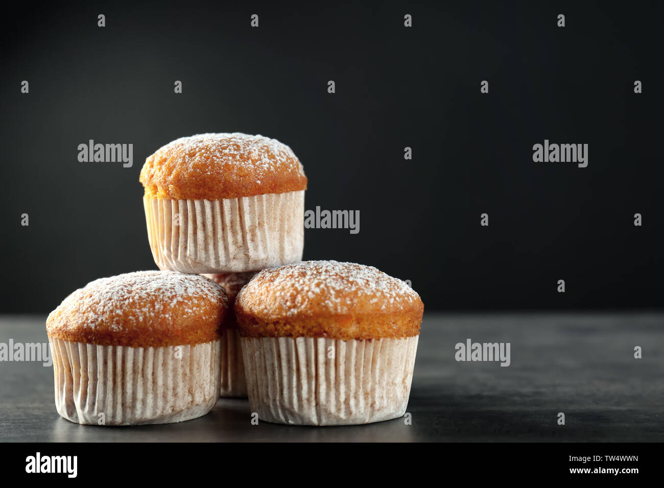 Delicious carrot muffins on dark background Stock Photo