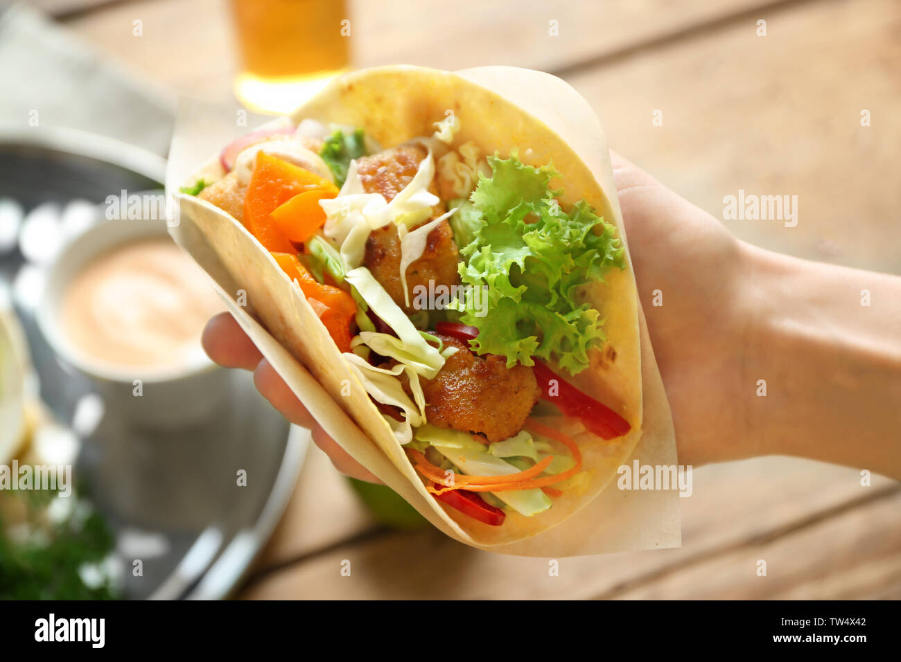 Hand Of Woman Holding Delicious Fish Taco Closeup Stock Photo Alamy