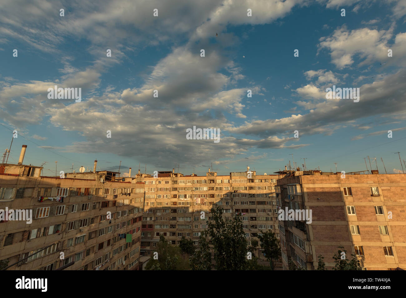 multi storey houses against the blue sky and white clouds Stock Photo ...