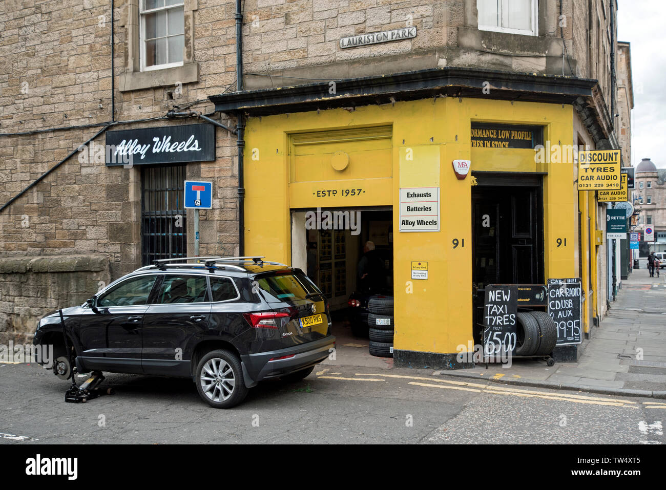 Tyre & Battery Depot, a small family business dealing in car audio, tyres and batteries in Tollcross, edinburgh, Scotland, UK. Stock Photo