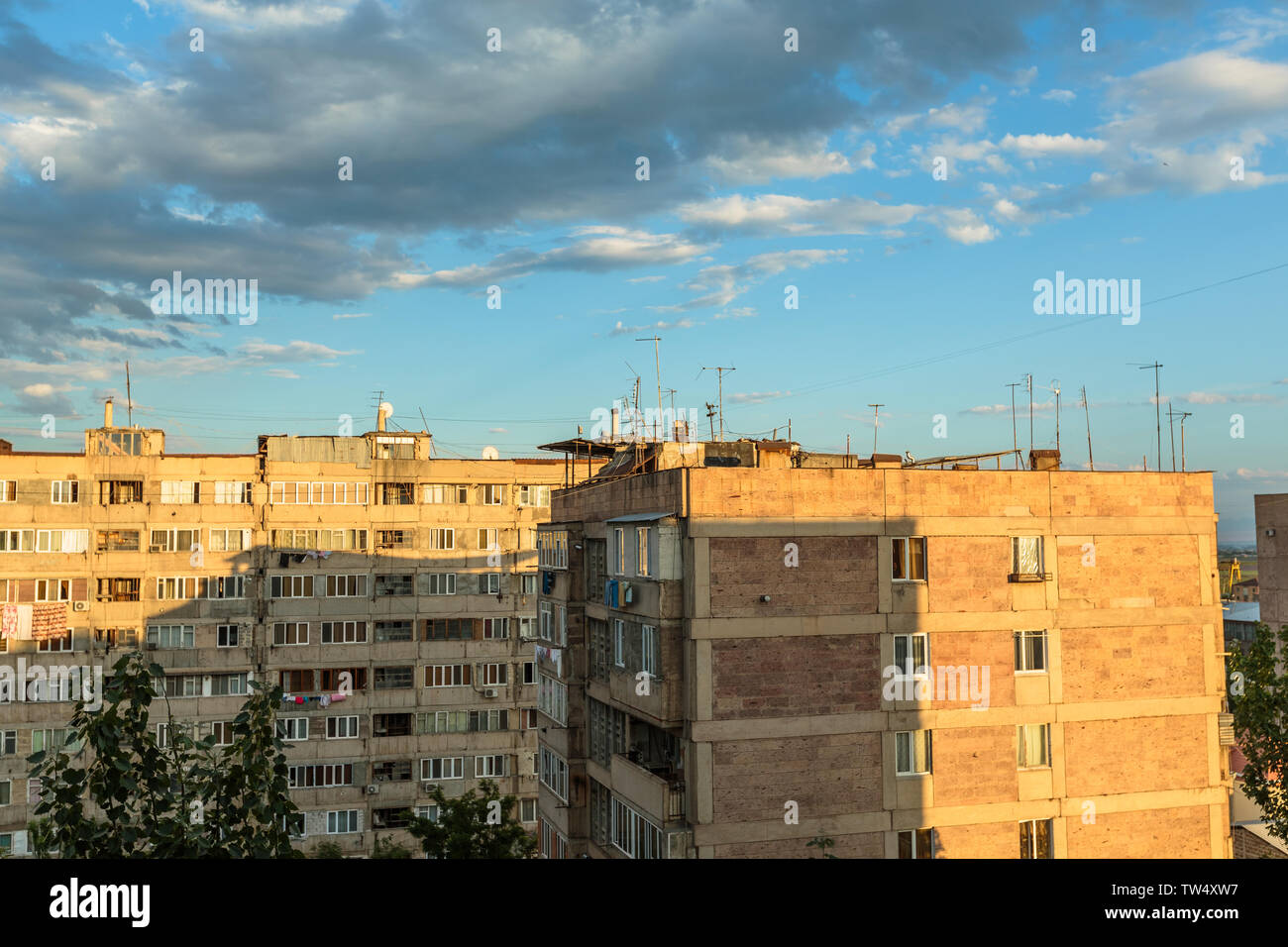multi storey houses against the blue sky and white clouds Stock Photo ...