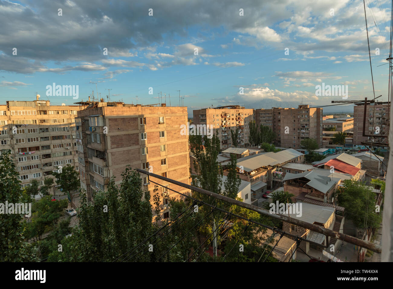 multi storey houses against the blue sky and white clouds Stock Photo ...