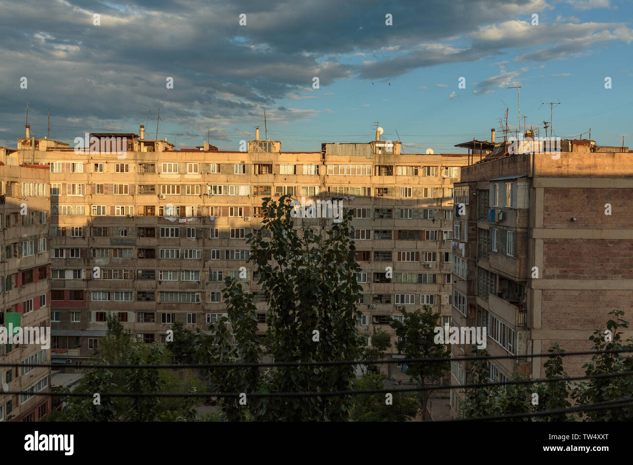 multi storey houses against the blue sky and white clouds Stock Photo ...