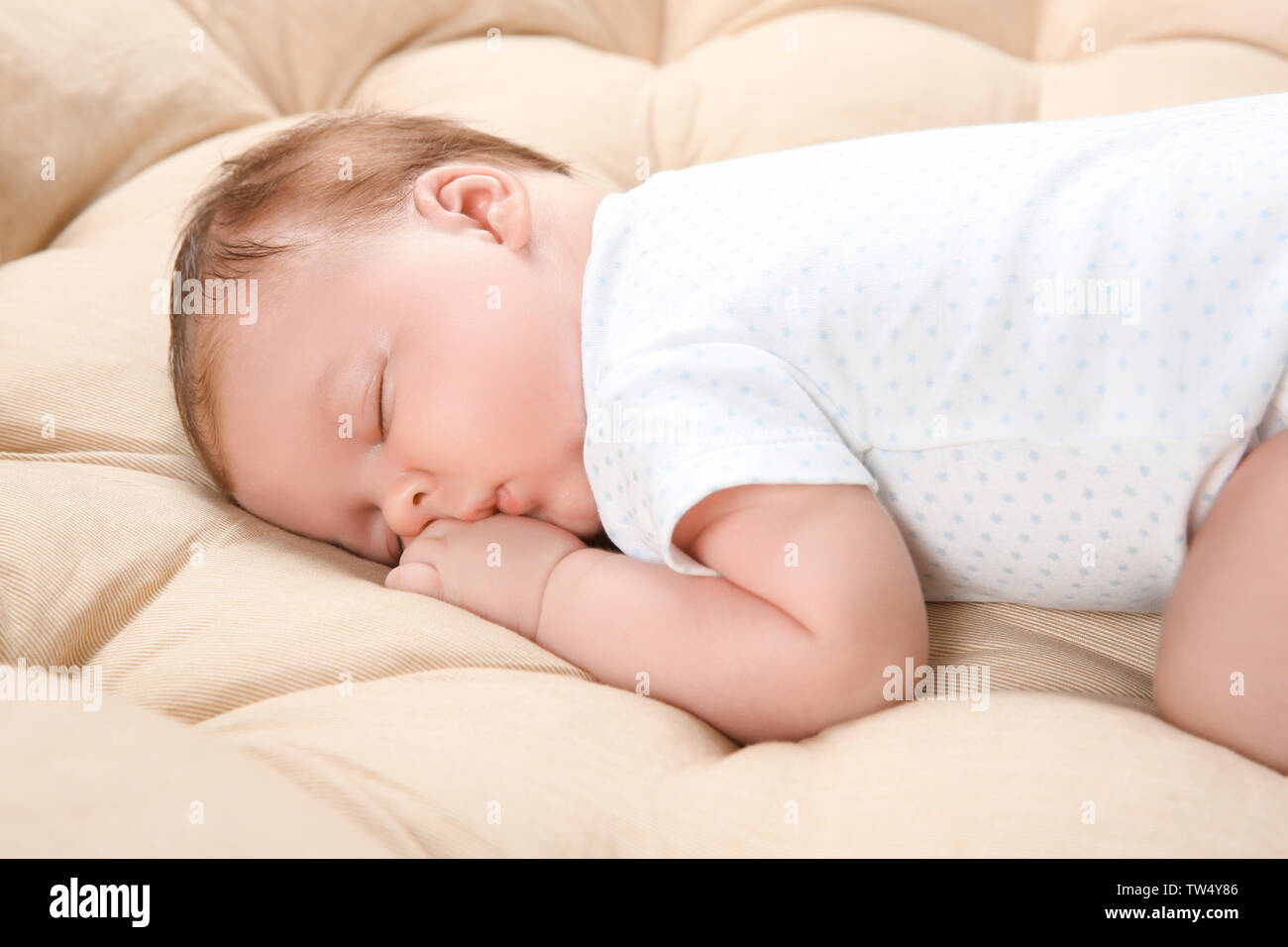 Cute newborn baby sleeping on lounge at home Stock Photo Alamy
