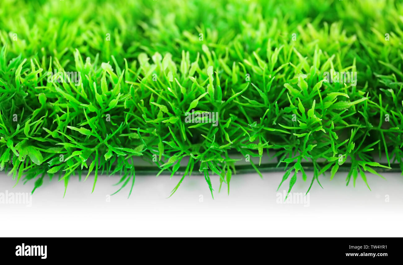 Artificial grass mat on white background Stock Photo - Alamy