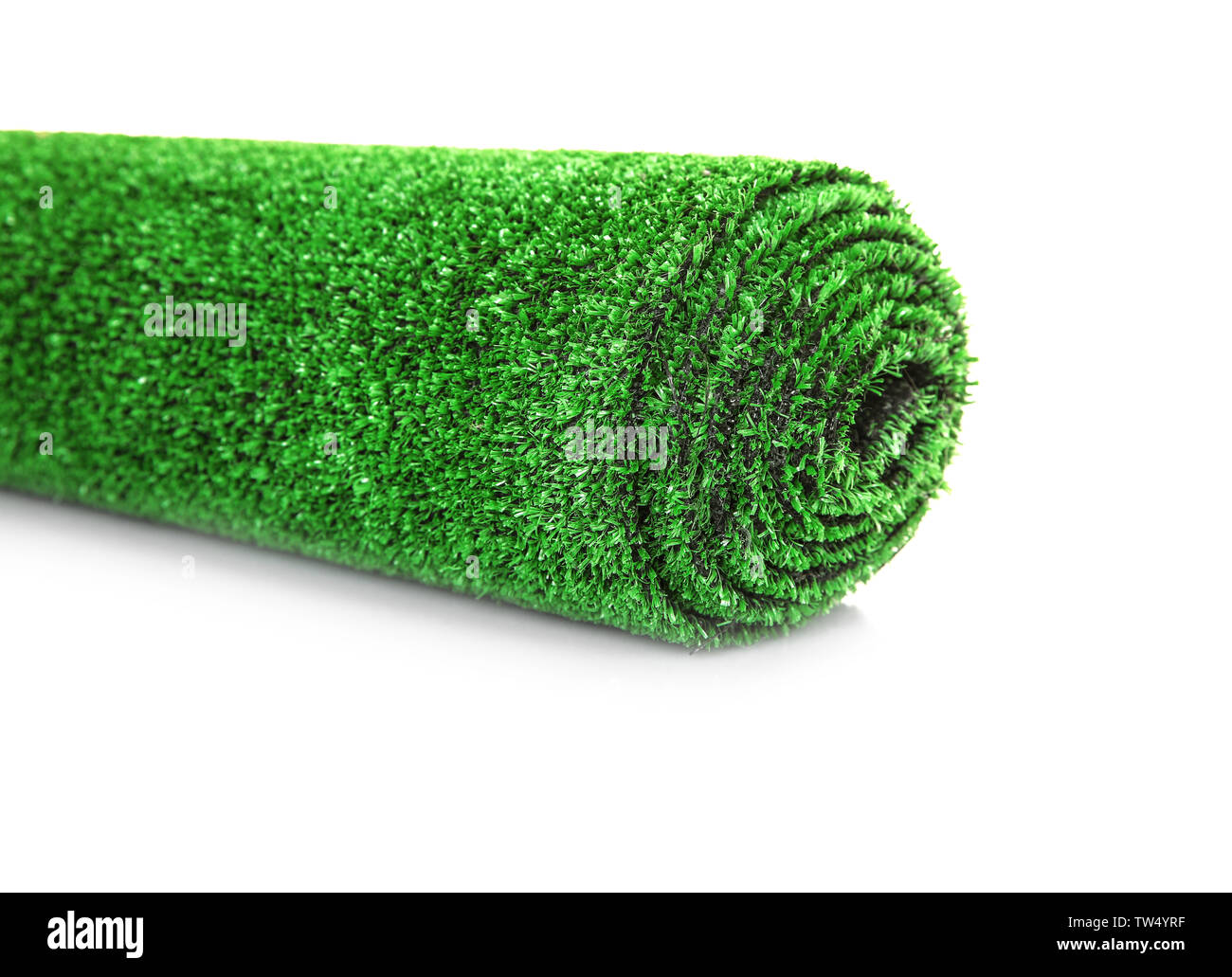 Roll of artificial grass mat on white background Stock Photo