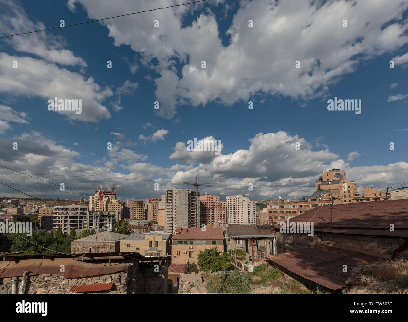 multi storey houses against the blue sky and white clouds Stock Photo ...