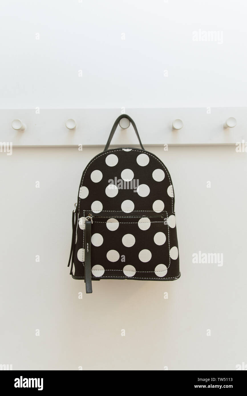 black polka dot backpack