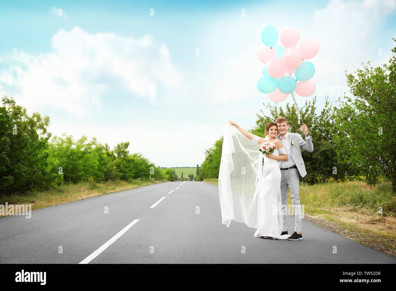 Happy beautiful couple on wedding day, outdoors Stock Photo - Alamy