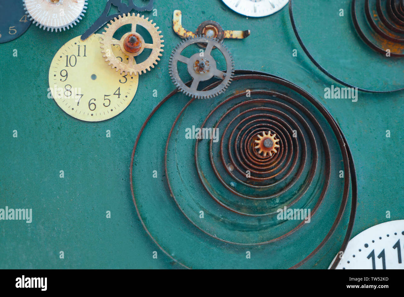 Creative composition with parts of mechanical clock on grunge