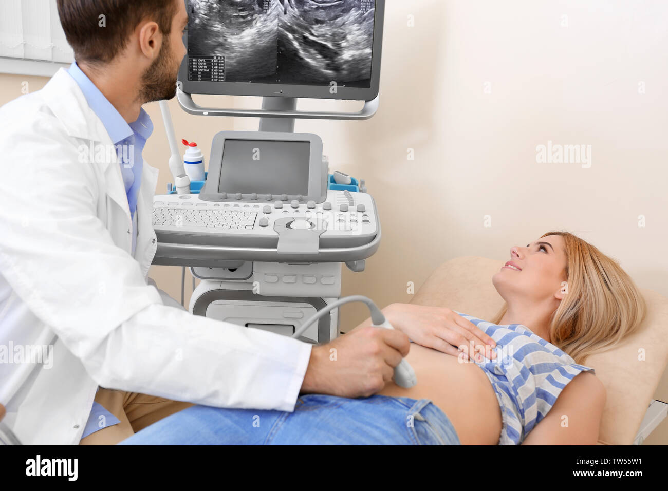 Young woman with ultrasound hi-res stock photography and images - Alamy