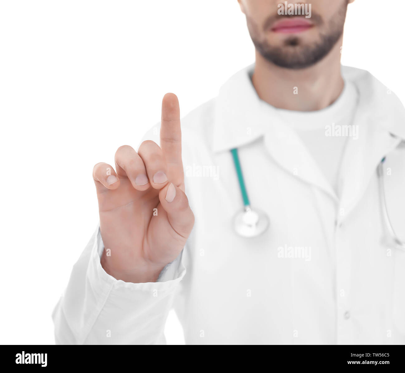 Young doctor using virtual screen, on white background Stock Photo