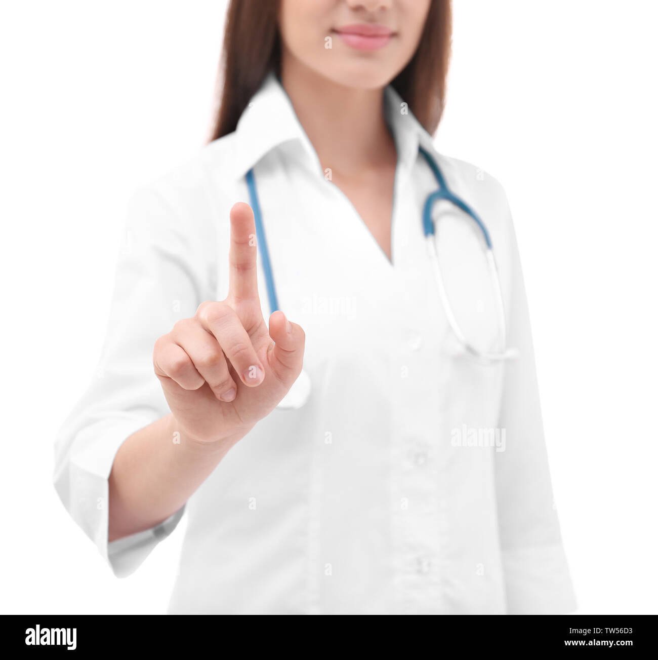 Young doctor using virtual screen, on white background Stock Photo
