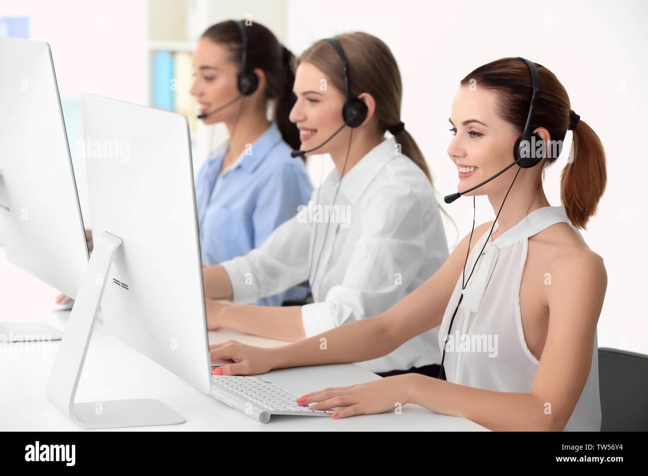Team of technical support dispatchers working in office Stock Photo - Alamy