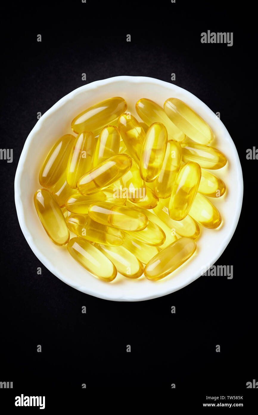 Fish oil capsules with omega 3 on white background Stock Photo Alamy