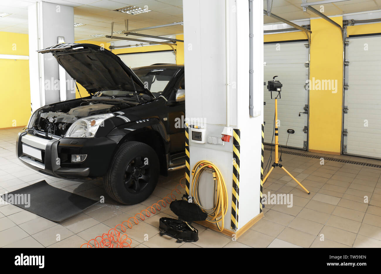 Modern car in repair shop Stock Photo