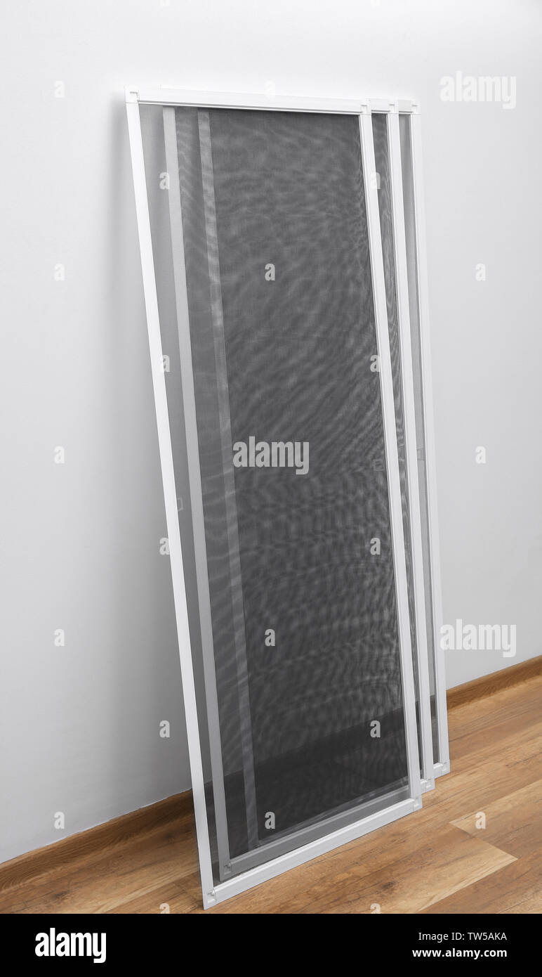 New mosquito window screens indoors Stock Photo Alamy