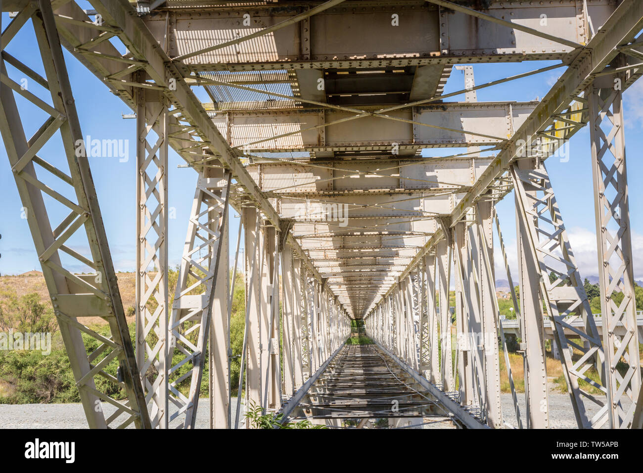 The inside view of a steel railway bridge, a part of the scenic railway route on the South Island, New Zealand Stock Photo