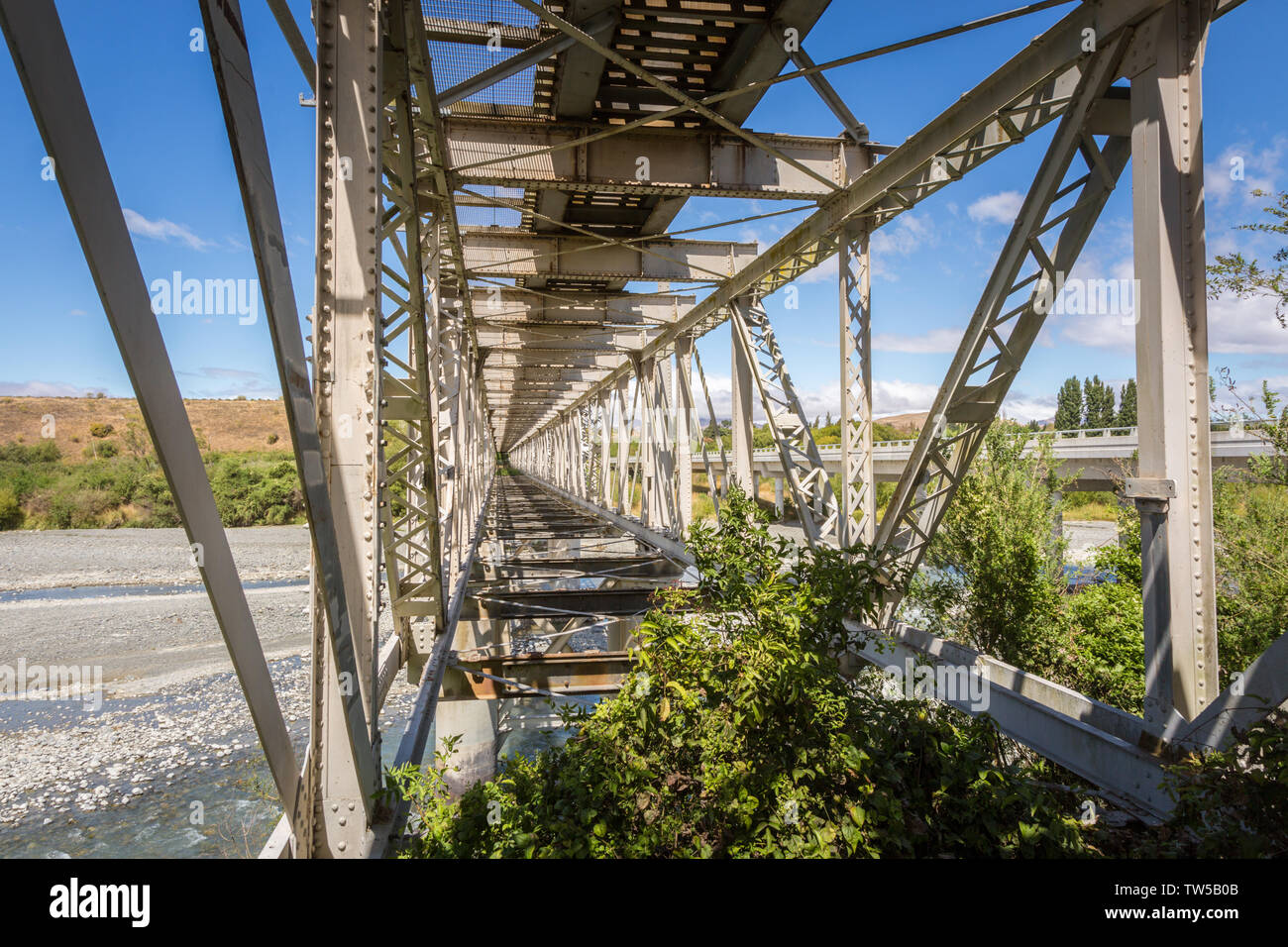 The inside view of a steel railway bridge, a part of the scenic railway route on the South Island, New Zealand Stock Photo