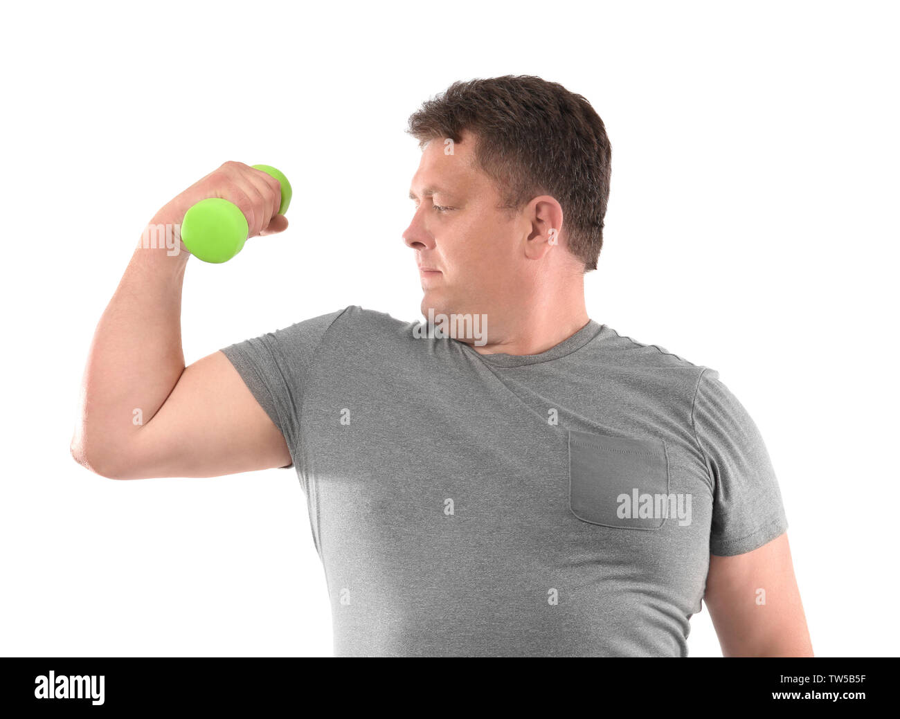 Overweight man with dumbbell on white background Stock Photo