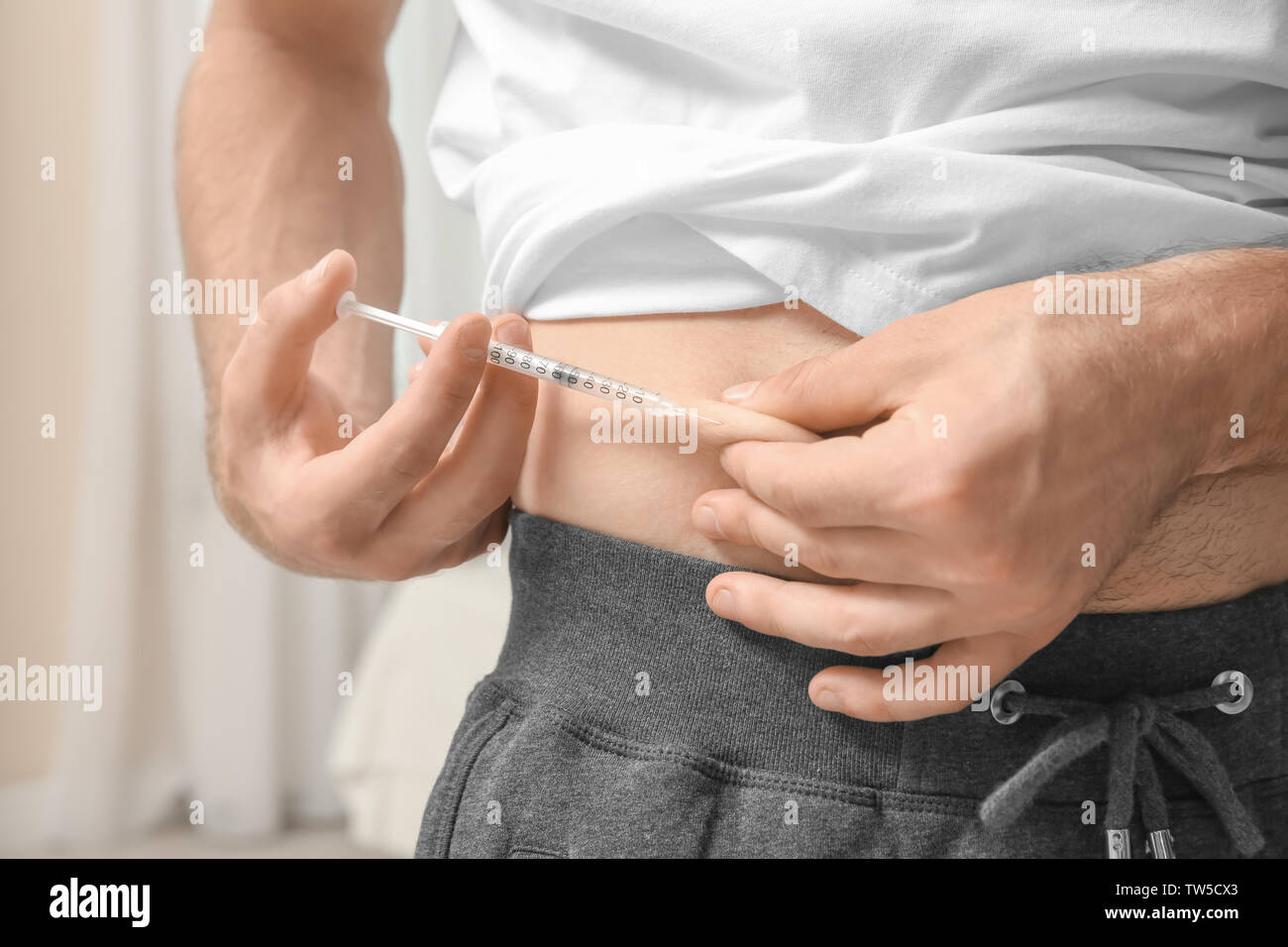 Diabetic patient injecting insulin in stomach, closeup Stock Photo Alamy