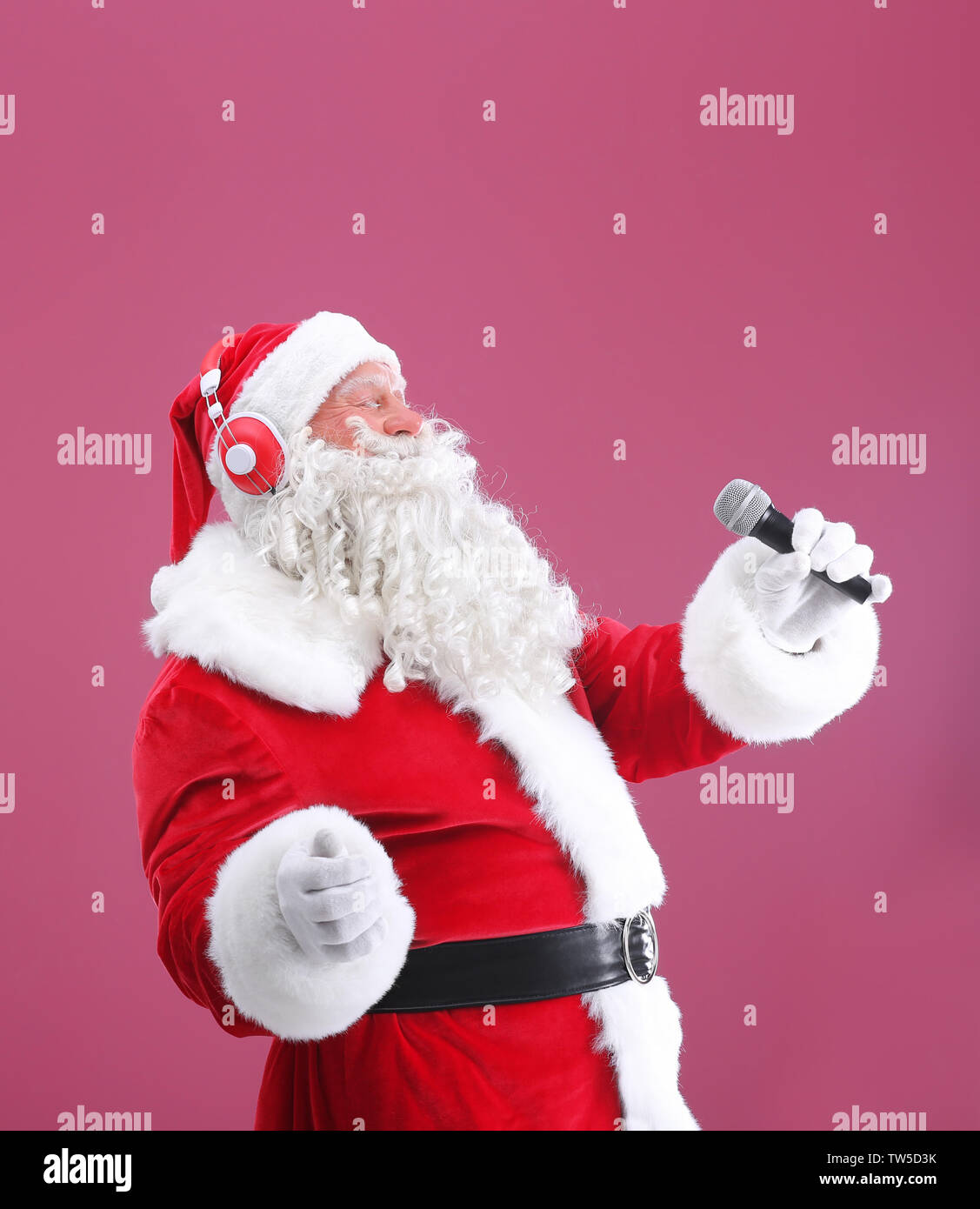 Santa Claus Singing Christmas Songs On Color Background Stock