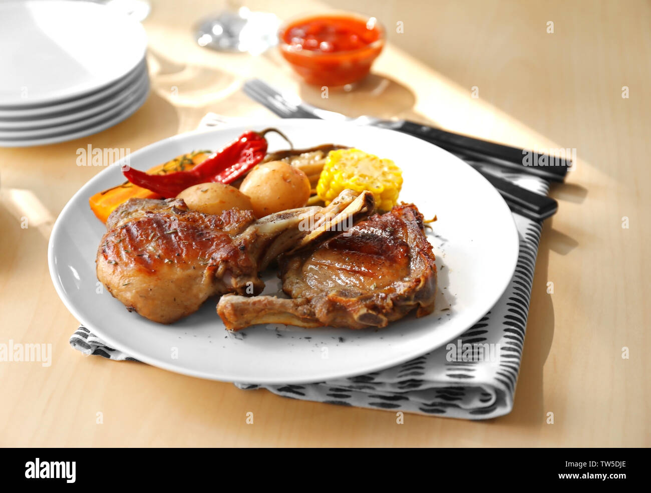 Plate with grilled meat on table Stock Photo Alamy