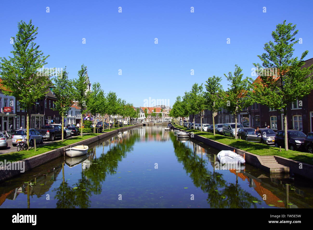 Historic central canal in the Dutch city of Weesp during a sunny summer