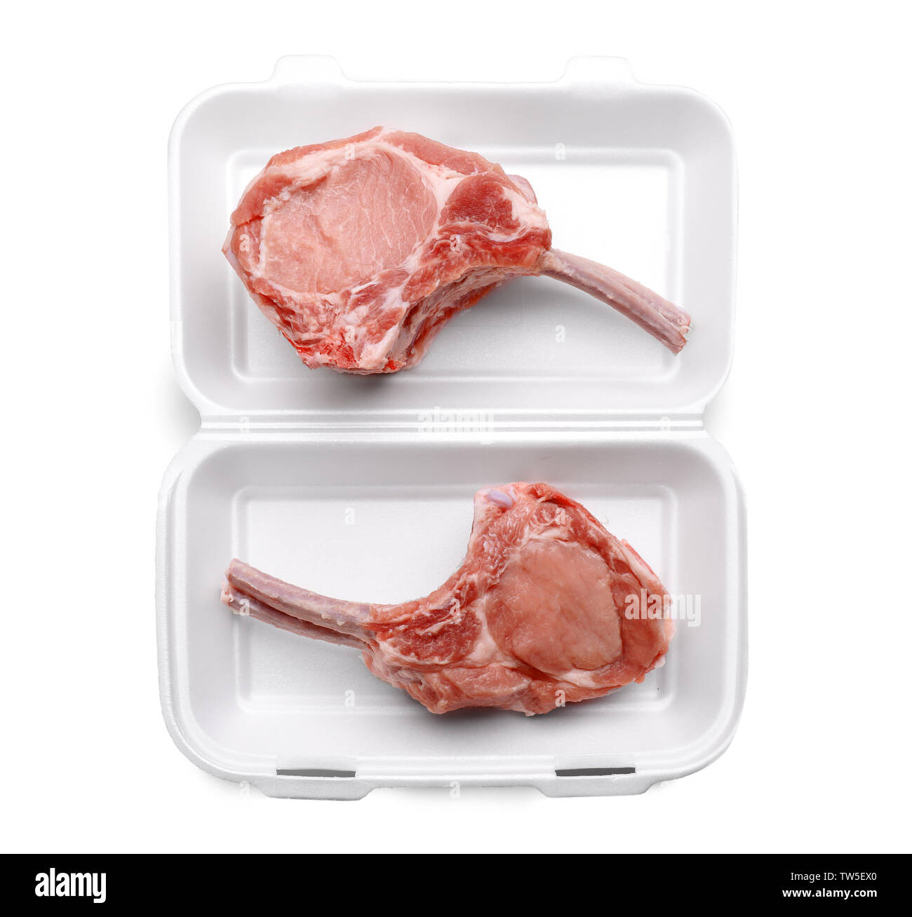 Raw ribs in container on white background Stock Photo - Alamy