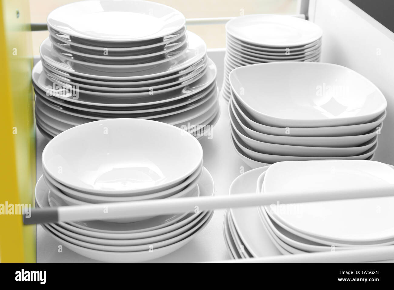 Plates in kitchen drawer Stock Photo Alamy