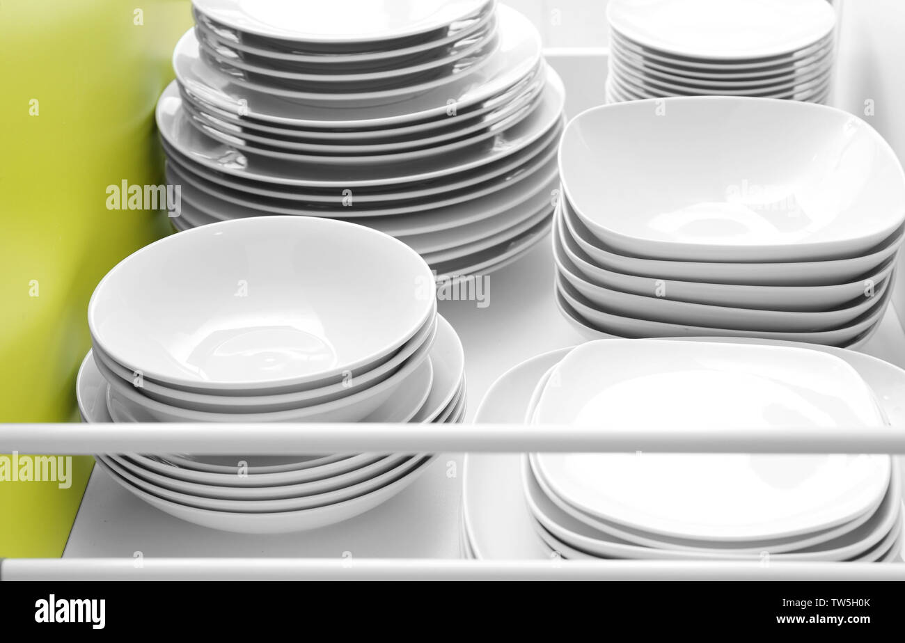 Plates in kitchen drawer Stock Photo Alamy