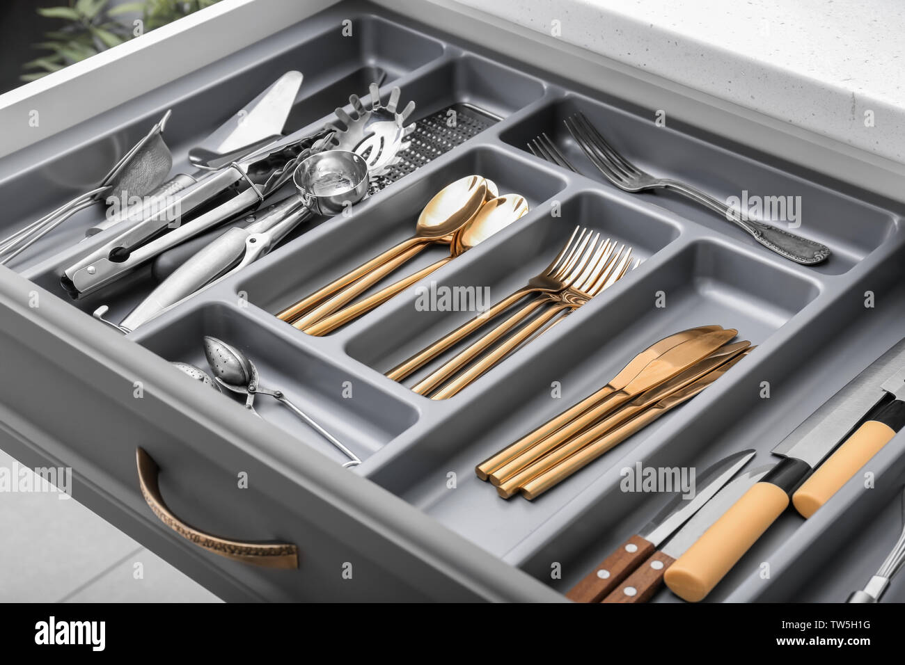 Kitchen utensils in drawer Stock Photo Alamy