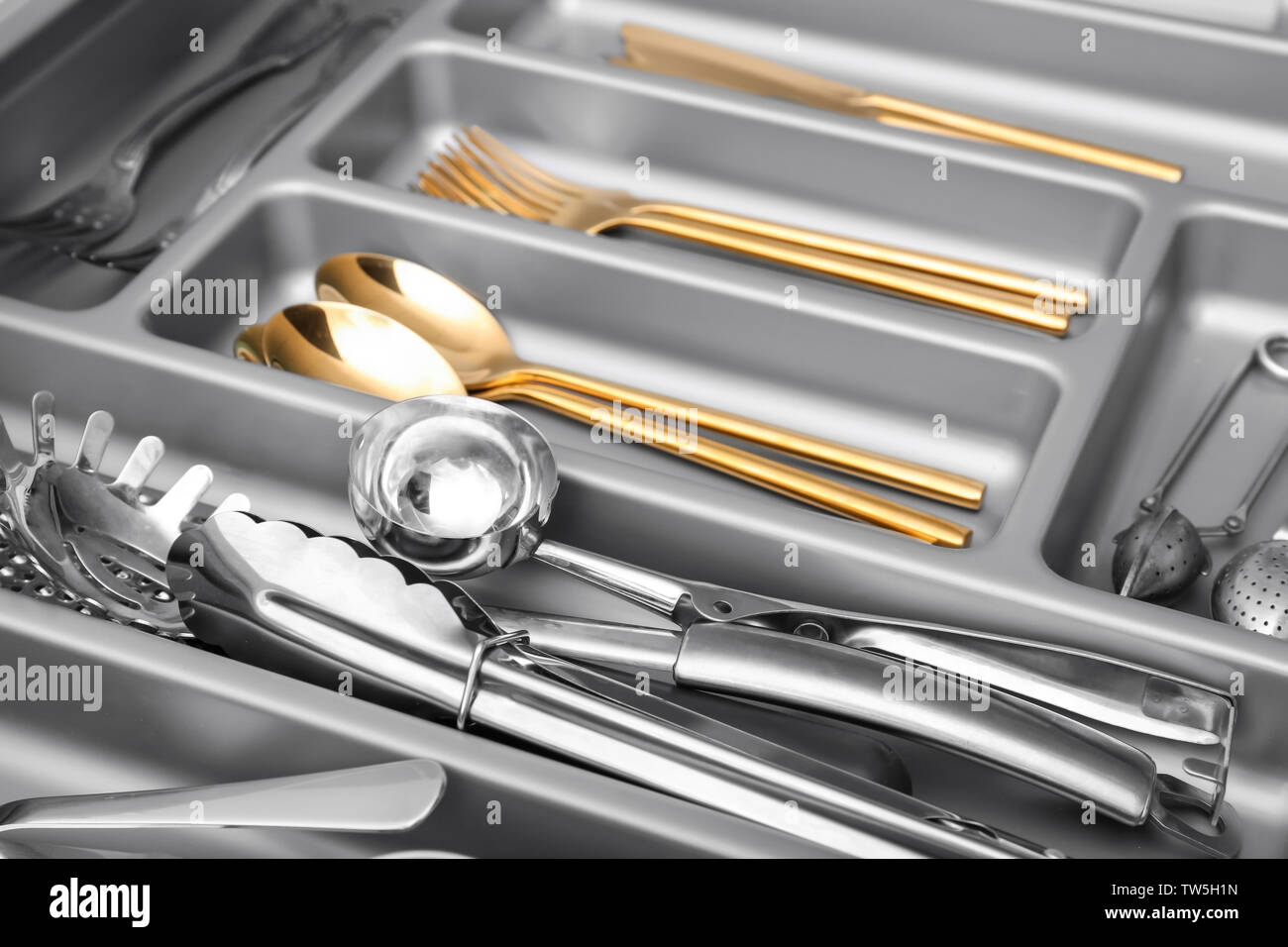 Kitchen utensils in drawer Stock Photo Alamy