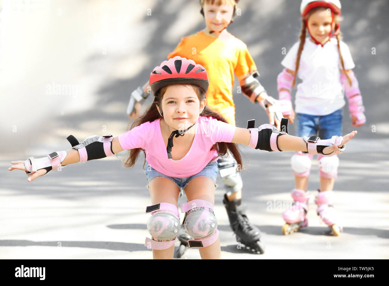 Cute girl rollerblading in skate park Stock Photo Alamy