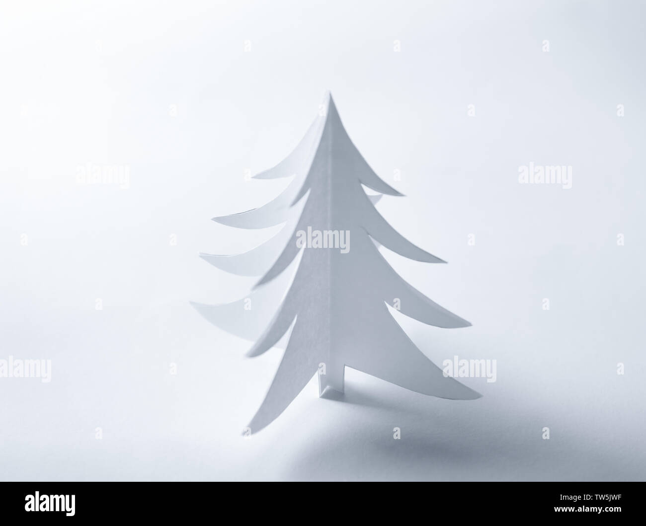 Christmas tree made of paper on white background Stock Photo - Alamy