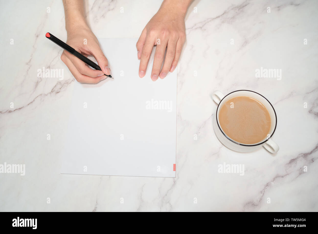 Business application background, hand holding pen writing, coffee