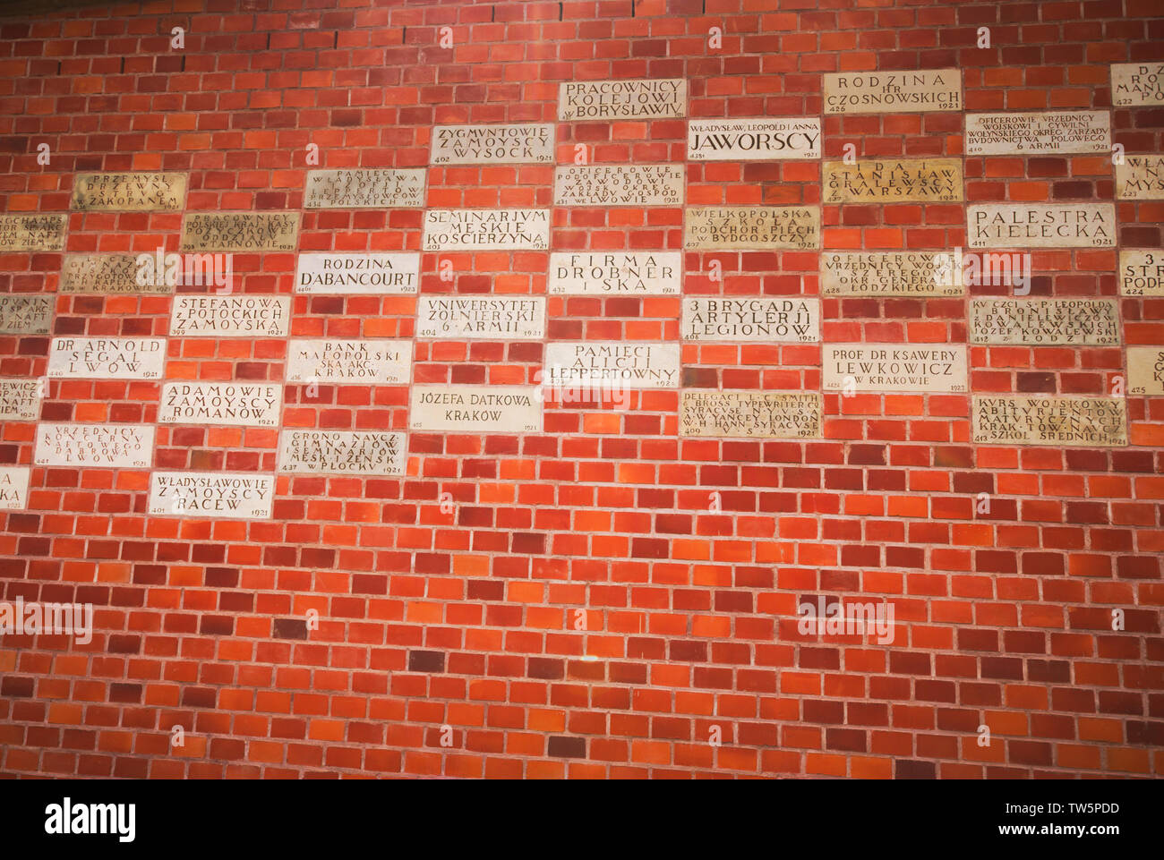 Commemorative sponsored plaques buried in fortification wall at Wawel Hill castle in Krakow, Poland Stock Photo