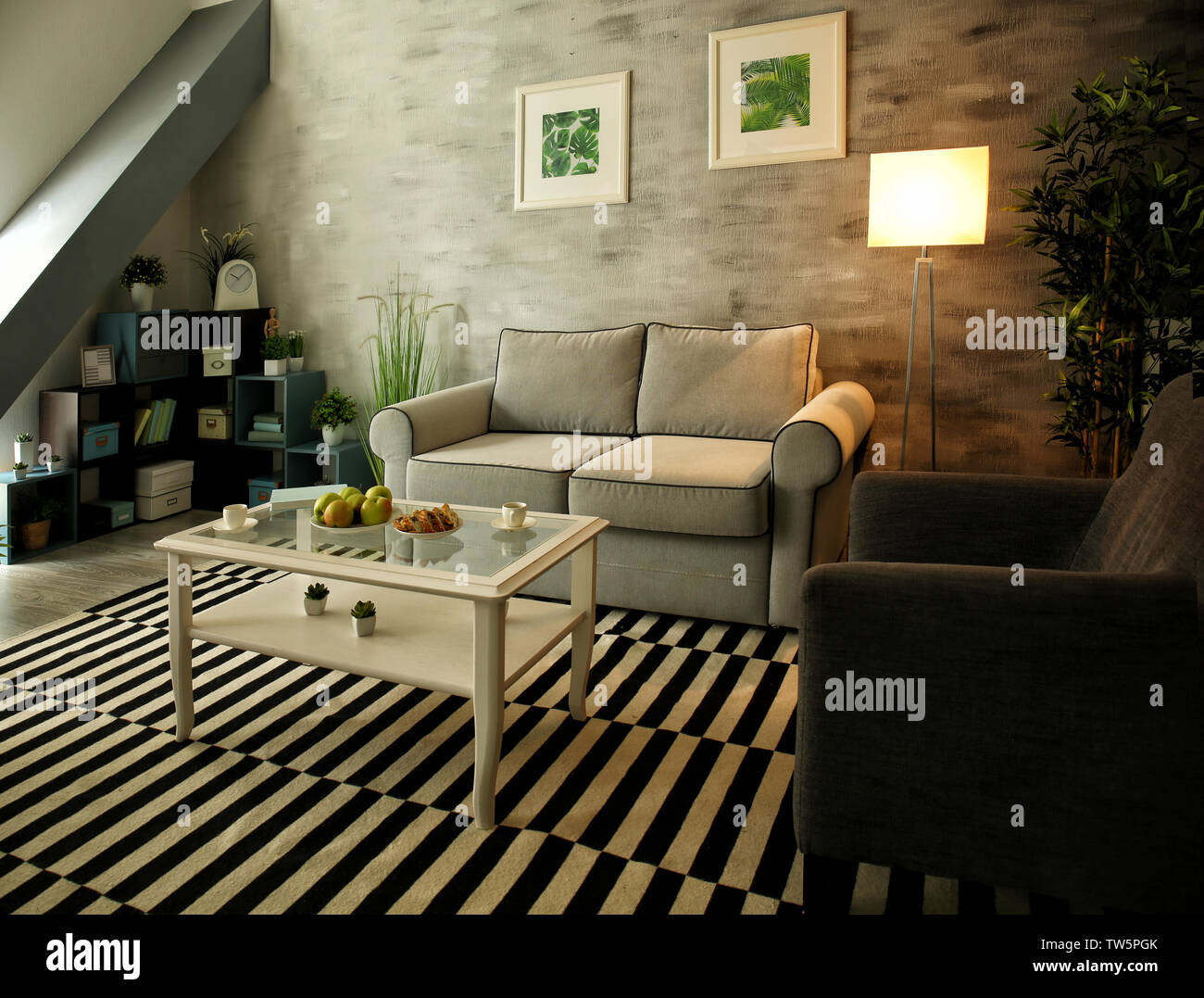 Modern living room design with big striped carpet Stock Photo - Alamy