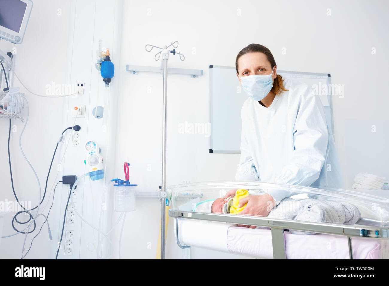 Premature born baby and nurse in hospital room Stock Photo Alamy