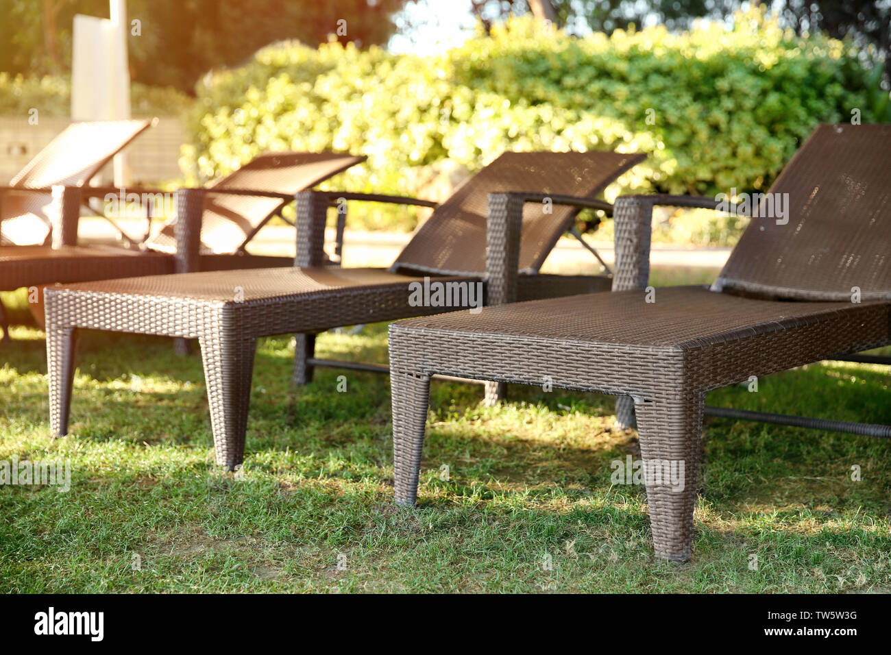 Sunbeds in courtyard of luxury hotel Stock Photo Alamy