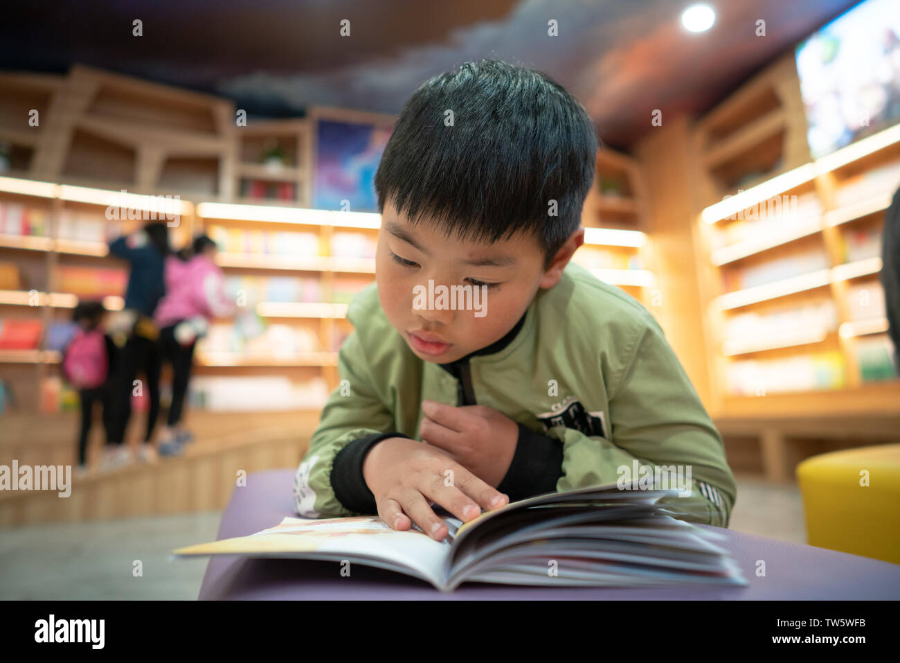 Filmed in the Xinhua Bookstore in Sihong County, Jiangsu Province on April 21, 2019, the spirit of serious learning made me press the shutter. They were too focused and did not find that I was filming them at all! Stock Photo