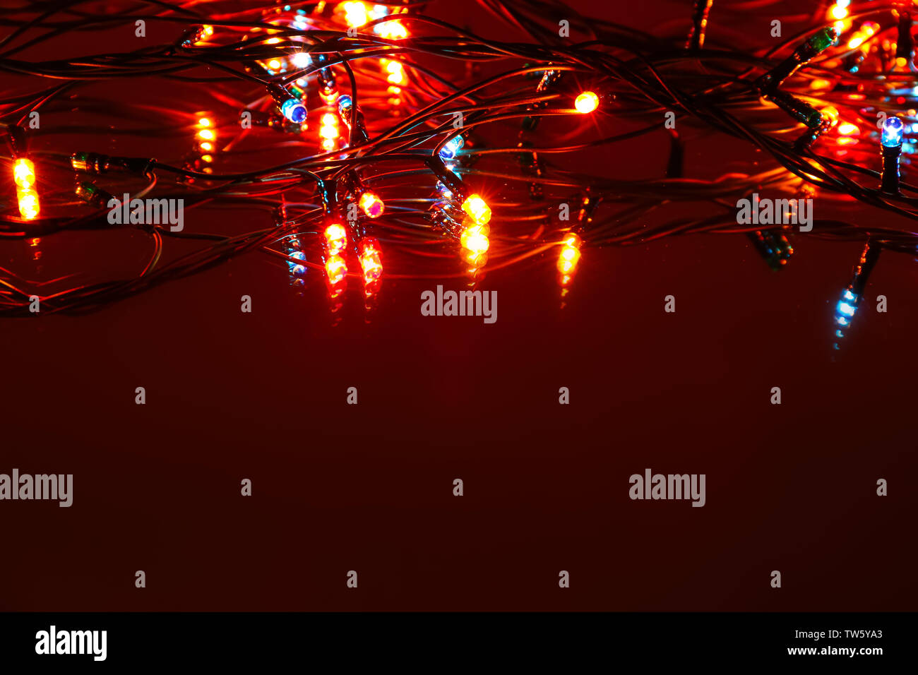 Christmas lights glowing on dark background Stock Photo Alamy