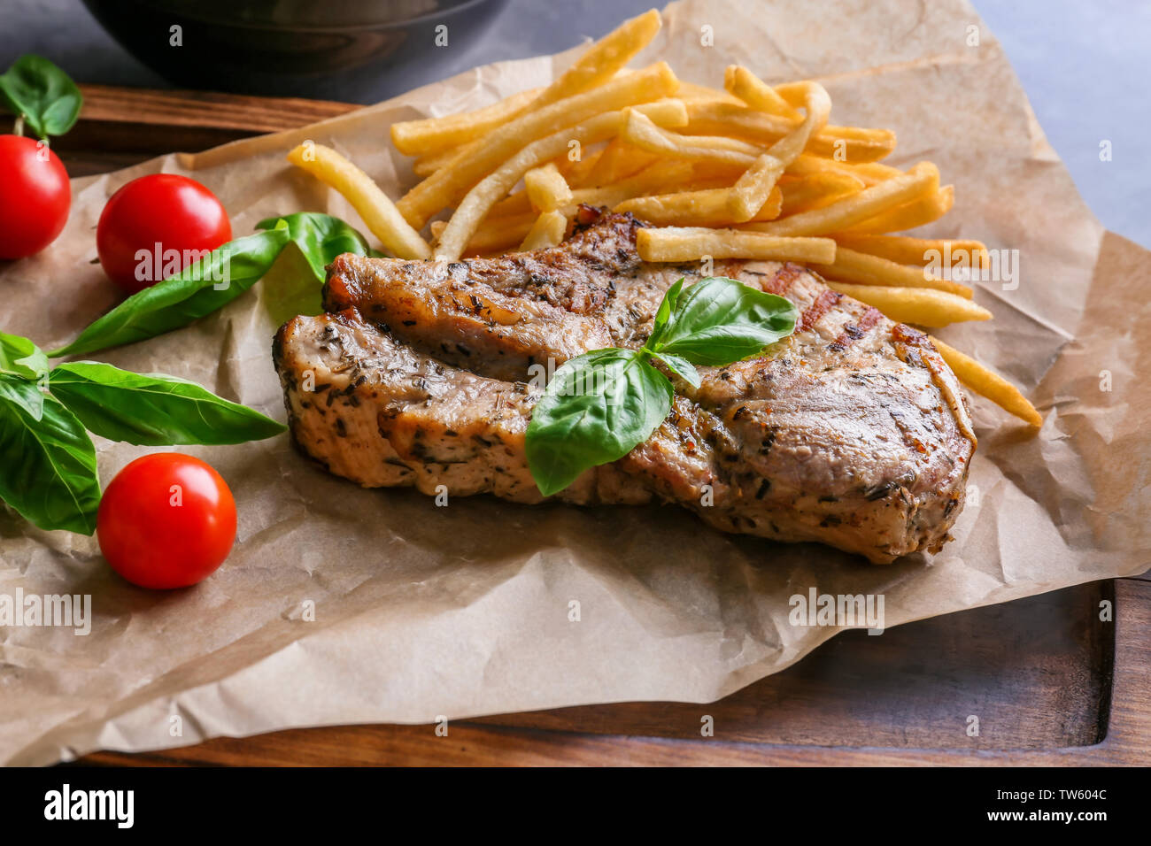 Delicious grilled steak frites on waxed paper Stock Photo Alamy