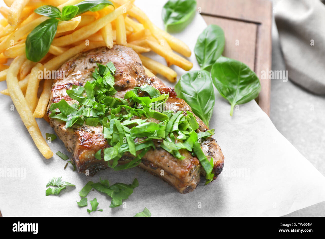 Delicious grilled steak frites on waxed paper Stock Photo Alamy